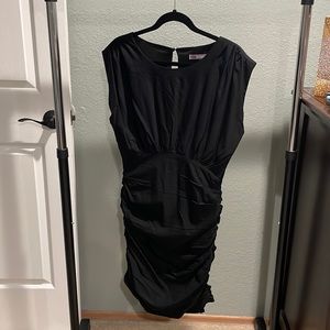 LBD- short length, short sleeves, peep hole in back, and ruched sides.